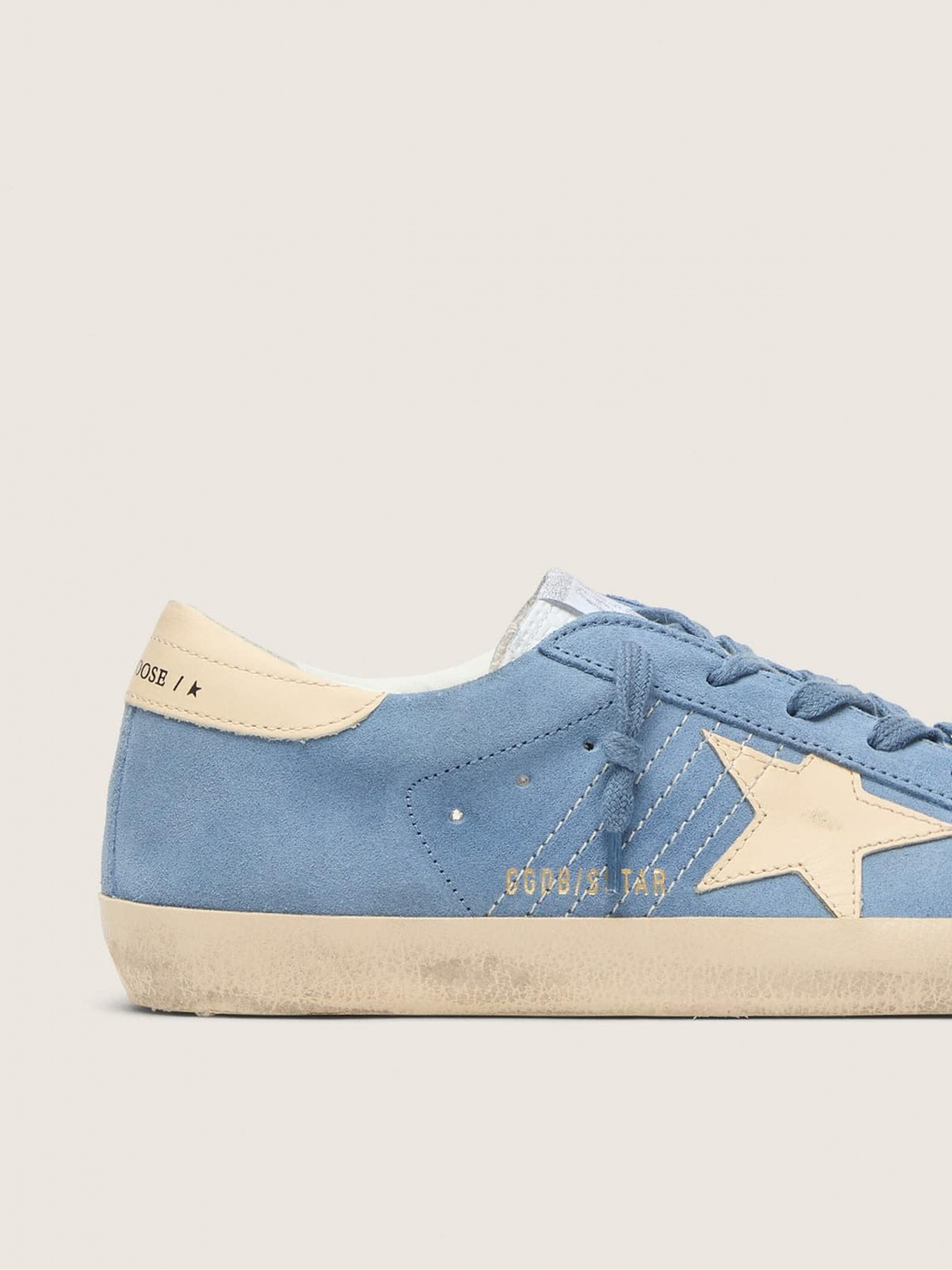 Super-Star in light blue suede with beige leather star and heel tab