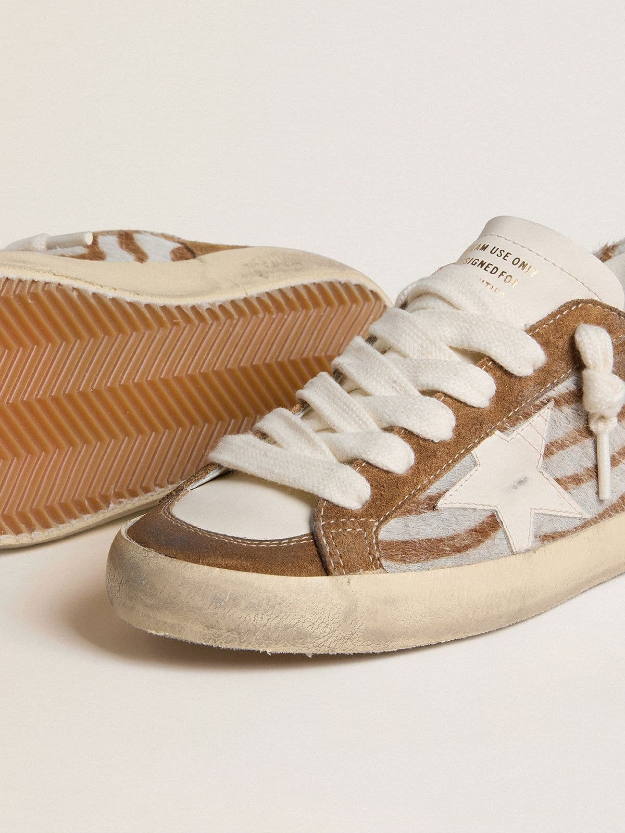 Women's Super-Star in zebra-print pony skin with leather star and brown suede inserts